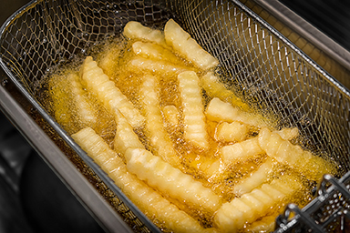 Zoye Oil Deep Frying French Fries in the Metal Frying Basket